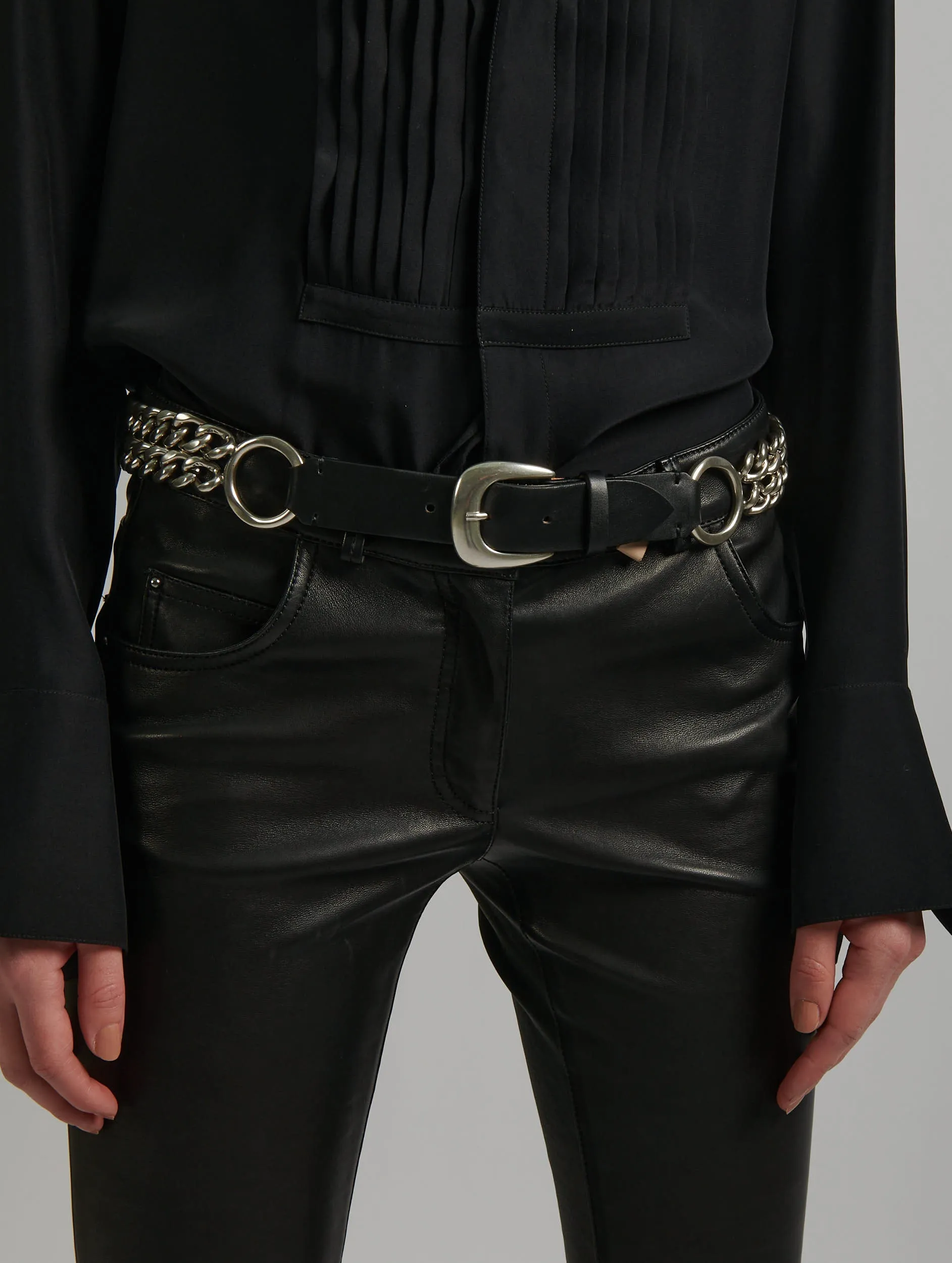 Metallic silver chain and leather belt